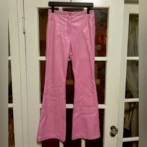 Super trendy pink faux leather flare pants! Soft on the inside and never worn!
